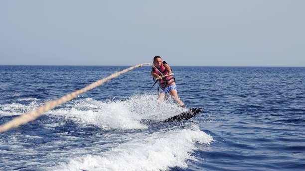 istock Man wakeboarder at sea in summer 871401928