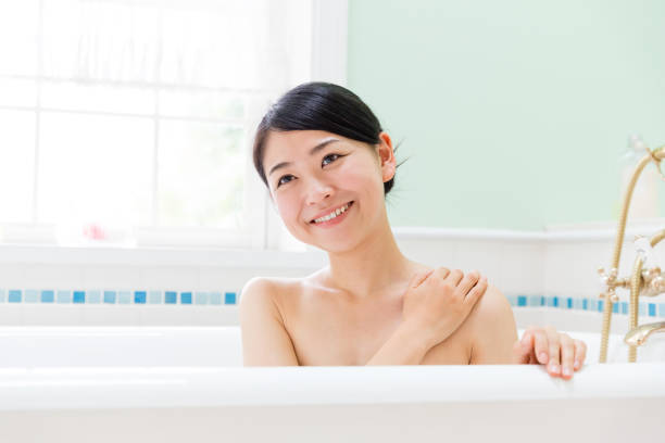 istock young asian woman in bathroom 871402708