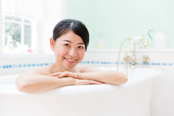 istock young asian woman in bathroom 871402730