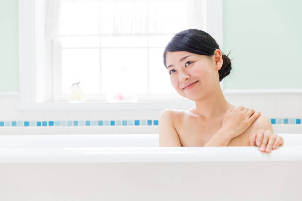 istock young asian woman in bathroom 871402732