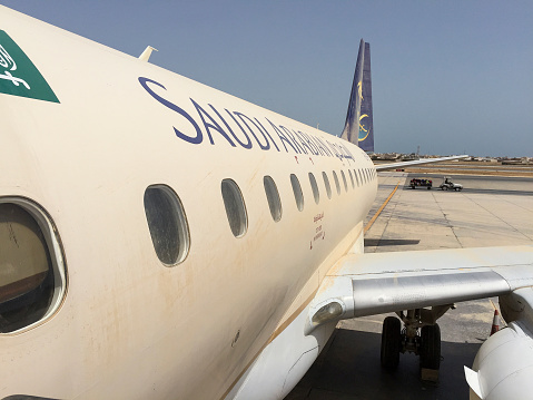 Saudi Arabian Airlines airplane covered in sand, after a sandstorm at Manama Airport
