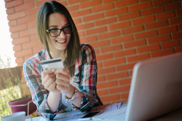 istock Young woman purchasing online 871406578