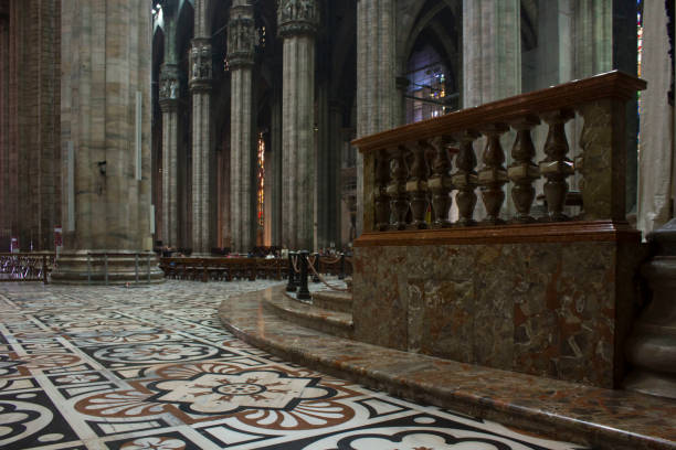 Inside Duomo cathedral in Milan Milan: Inside Duomo cathedral in Milan, detail of the decorated floor in candoglia marble with flower pattern candoglia marble stock pictures, royalty-free photos & images