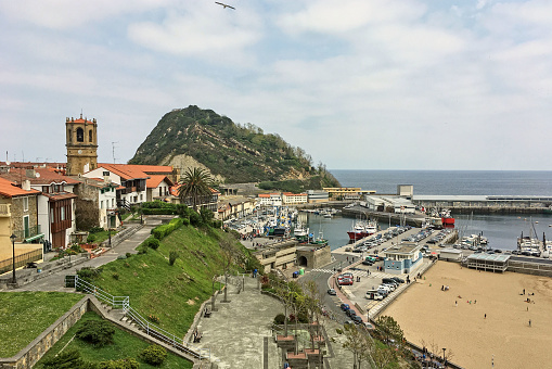 Getaria, Spain - May 1, 2017: Panoramic view of the beach, fishing port and the town of Getaria. Gipuzkoa, Basque Country