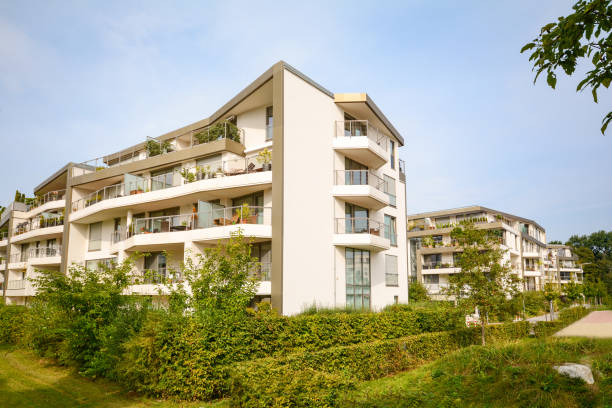 modern residential buildings, new apartment houses with green outdoor facilities in the city - stockyards industrial park imagens e fotografias de stock