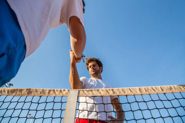 istock Tennis players holding hands 871413070