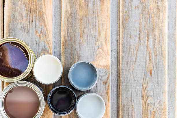 istock Open Cans of Different Paints, Varnish and Stain 871414938