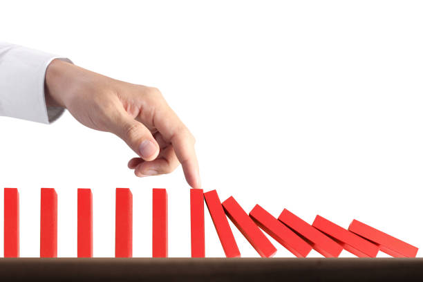 istock Hand Stopping domino concept 871435006