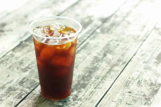 istock Iced coffee black coffee on wood table 871441544