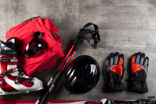 Winter sport theme. Ski equipment on gray tiles. Place for typography. stock photo