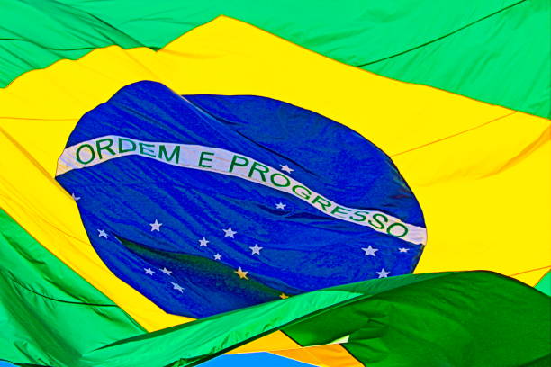 istock Ordem e Progresso – Order and Progress: Colorful Brazillian Flag waving in the Sky – Rio de janeiro, Brazil 871444948