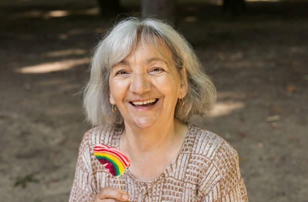 Senior woman with lolipop stock photo