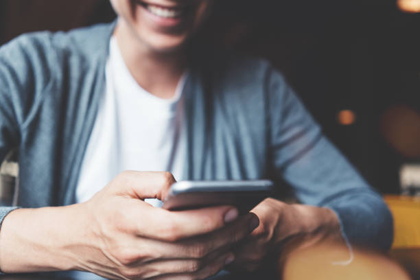 istock Woman using mobile phone in cafe. Close-up 871450736