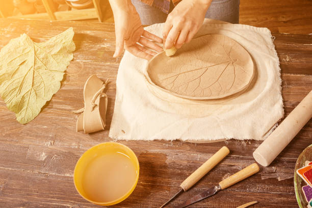 istock woman potter sculpts clay 871451322