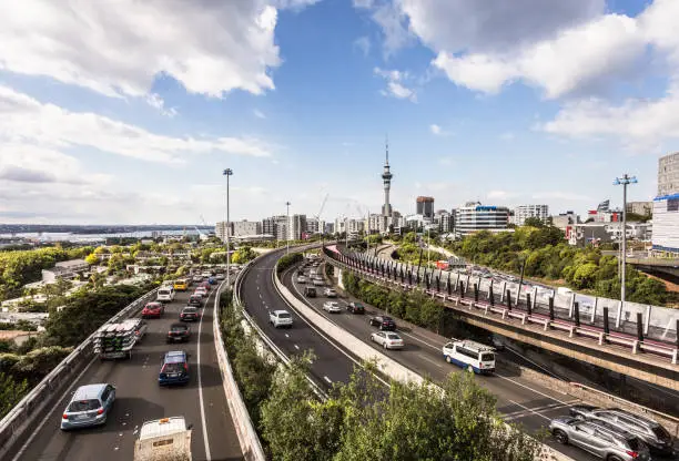Heavy traffic along the spaghetti junction of various highways in Auckland, New Zealand largest city on a sunny day.