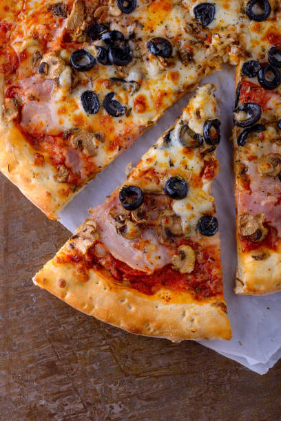 istock Homemade pizza with bacon, olives, mozzarella 871460996