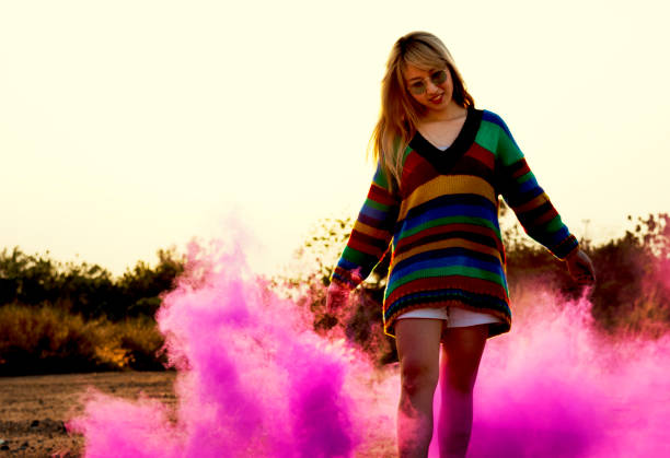 istock Person having fun with pink powder 871461778