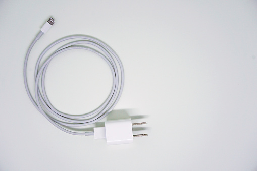 Smartphone Charger Lightning Adapter on White Background Top View