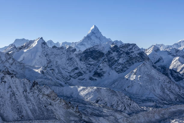 istock Ama Dablam mountain landscape. Sharp mountain peak standing out among Himalayan mountain range. Stunning mountain range scenery on the way to Everest Base Camp Trek. 871468506