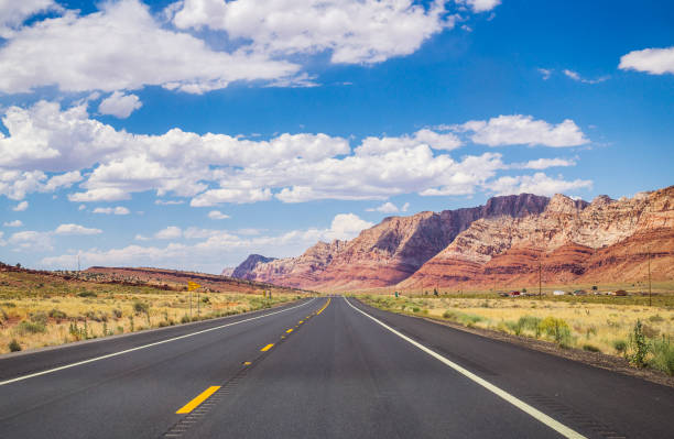 Picturesque road in Arizona. red stone cliffs and blue sky Journey to the south of the USA. Modern roads and stone landscapes of Utah, Nevada and Arizona route 66 stock pictures, royalty-free photos & images