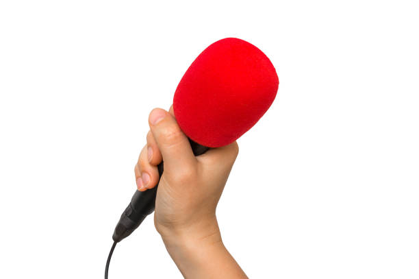 istock Hand of woman with red microphone isolated on white 871475468