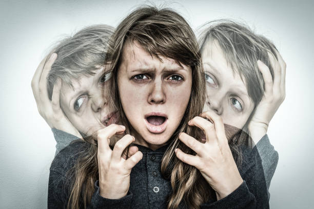 istock Woman with split personality suffers from schizophrenia 871475920