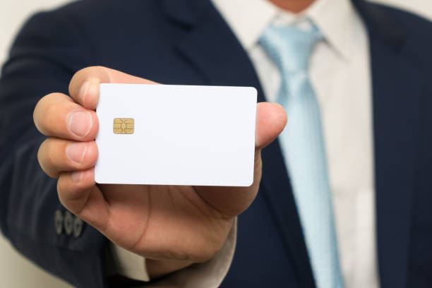 istock Man holding holding blank credit card 871476040
