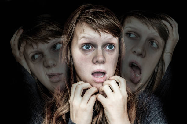 istock Woman with split personality suffers from schizophrenia 871478158