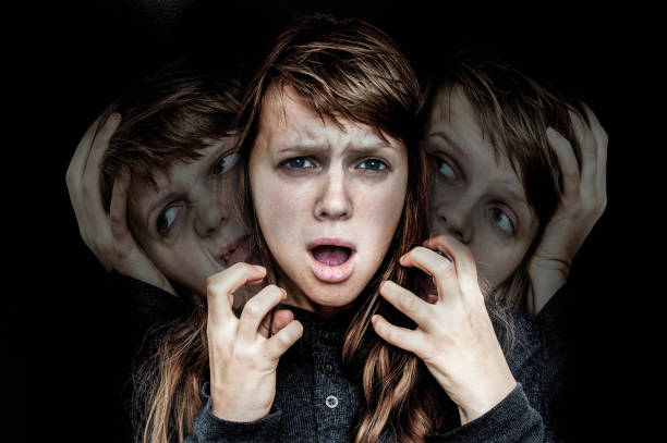 istock Woman with split personality suffers from schizophrenia 871478350