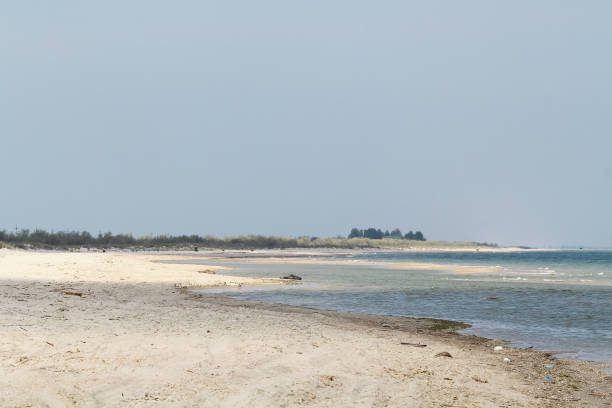 istock An empty sea sandy beach on beautiful summer day with blue sky 871478614