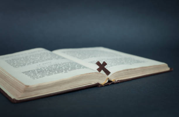 istock Cross and bible on a blue background. 871479446