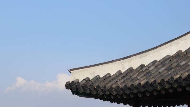 istock Black roof tiles and blue sky. 871482292