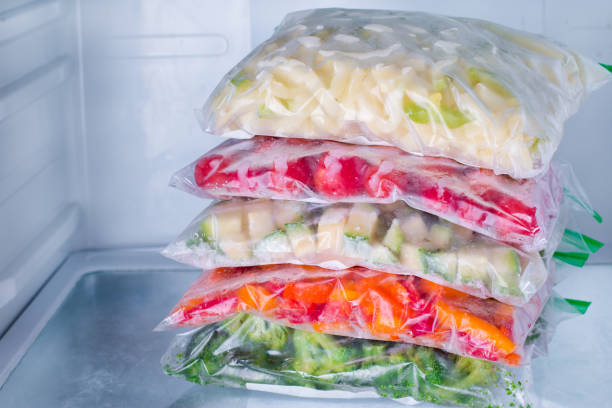 istock Frozen vegetables in bags in refrigerator 871482460