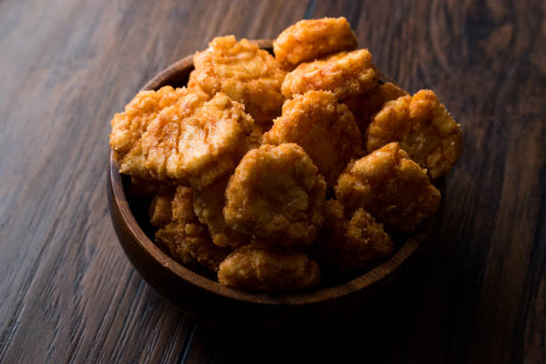 istock Thai Chilli Spicy Rice Crackers in wooden bowl. 871482540