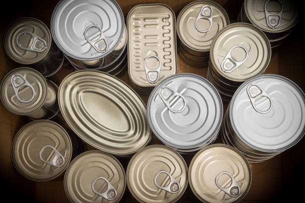 closeup of a group of aluminium cans. - canned food imagens e fotografias de stock