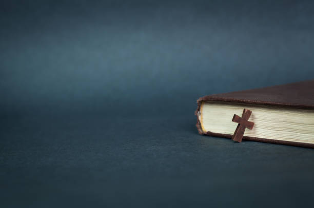 istock Cross and bible on a blue background. 871483758