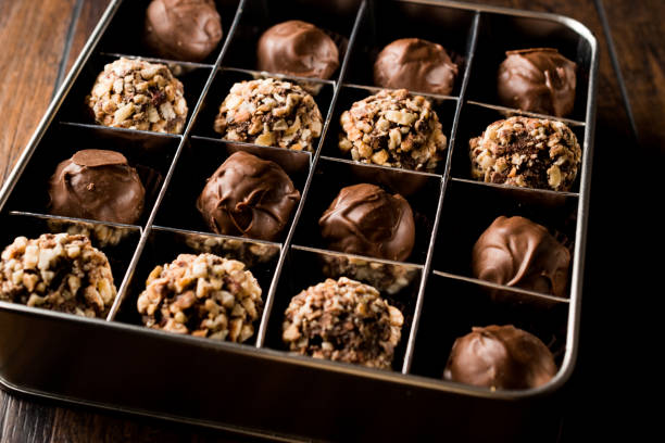 istock Box of Chocolate Pralines with Hazelnuts. 871483998