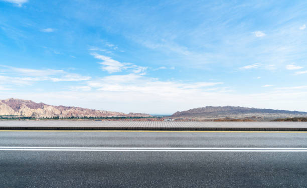 istock empty road travel through danxia landform,gansu 871486114