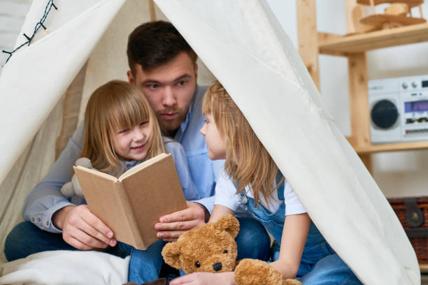 istock Male babysitter working with kids 871486140