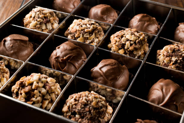 istock Box of Chocolate Pralines with Hazelnuts. 871487222