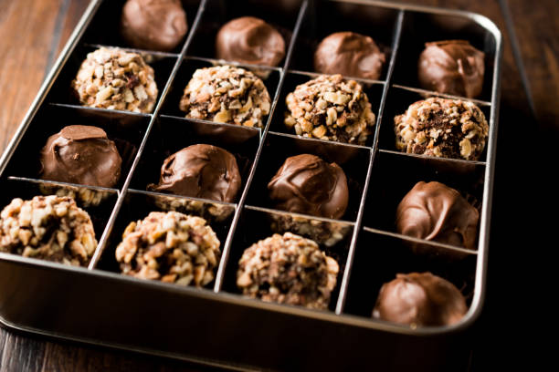 istock Box of Chocolate Pralines with Hazelnuts. 871487330
