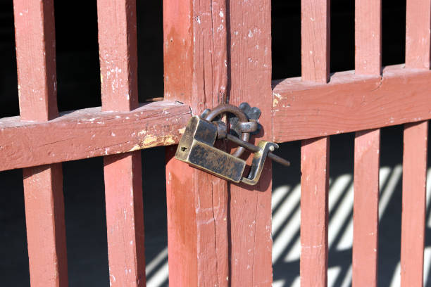 A wooden gate and an old lock