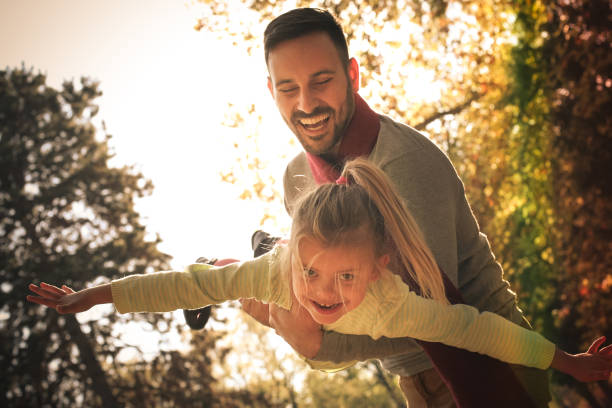 istock Father have play with daughter at park. 871490946