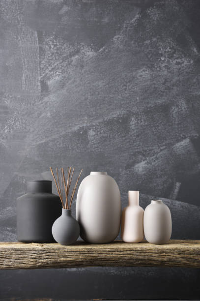 istock Various vases on wooden shelf 871496398