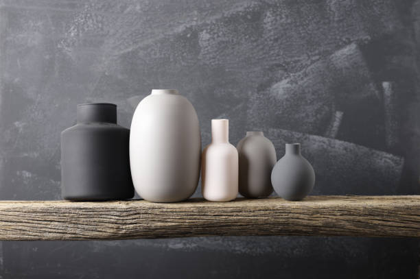 istock Various vases on wooden shelf 871496476