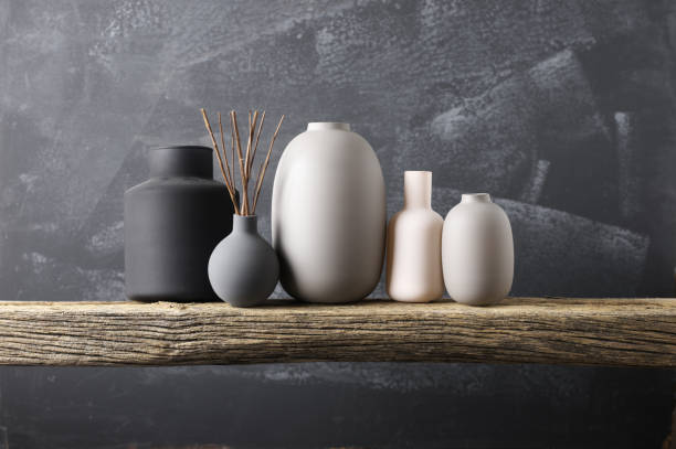 istock Various vases on wooden shelf 871496894