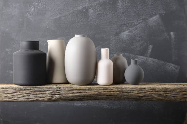 istock Various vases on wooden shelf 871497020