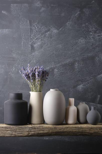 istock Various vases on wooden shelf 871497030