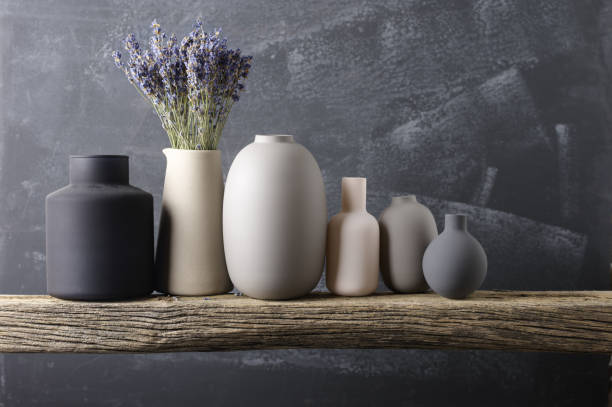 istock Various vases on wooden shelf 871497040