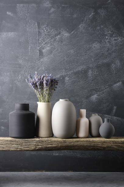 istock Various vases on wooden shelf 871497048